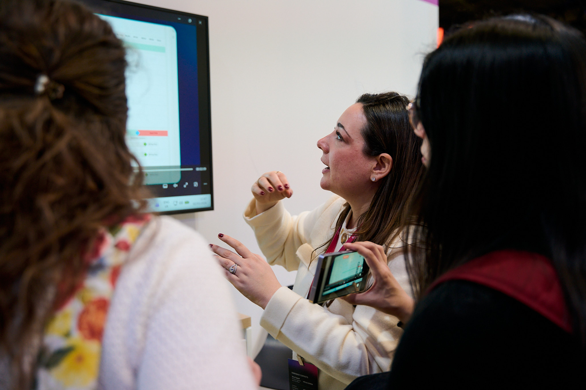 Woman presenting digital project at mwc 2026 conference