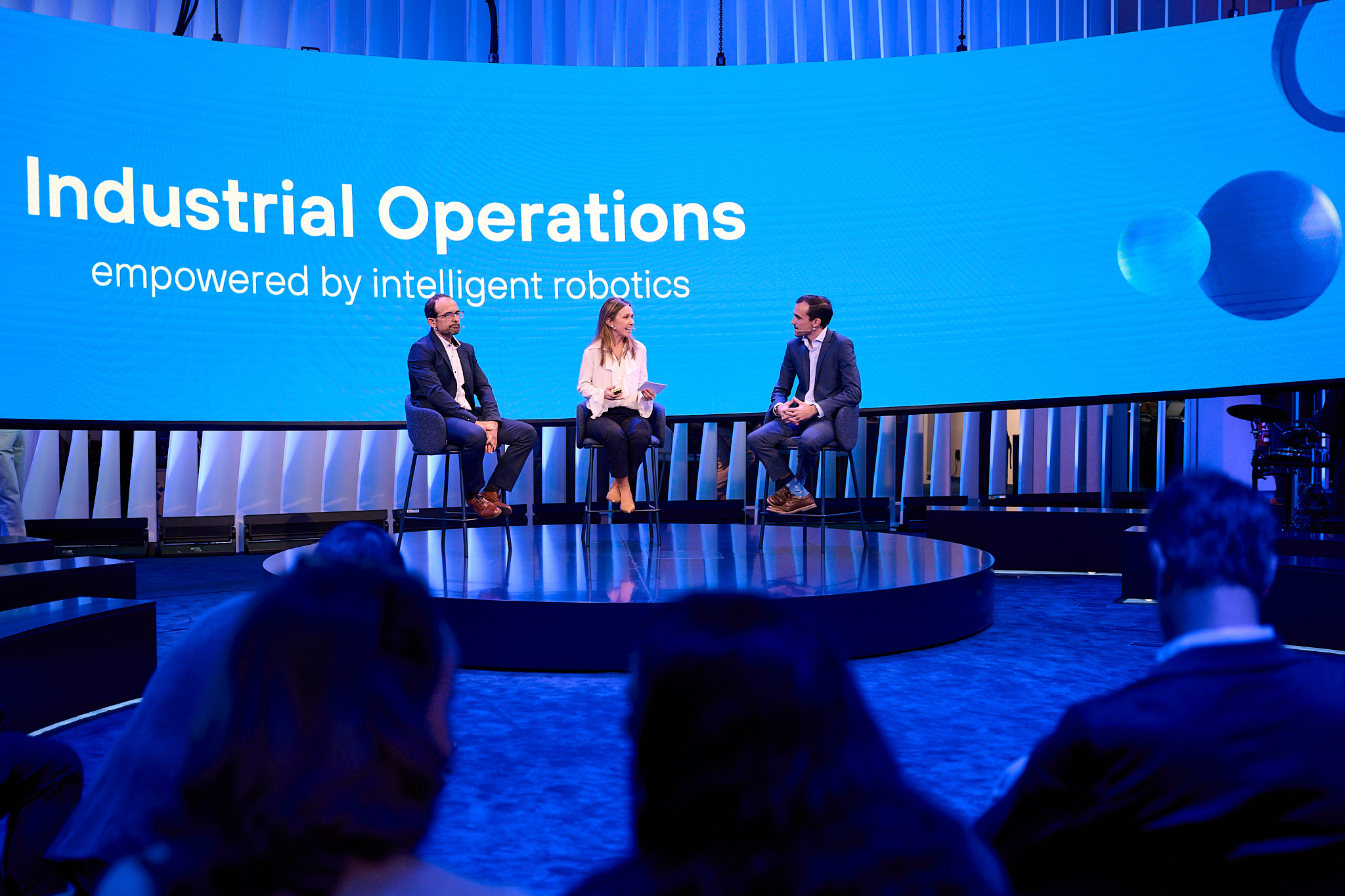 Experts discussing industrial operations empowered by intelligent robotics