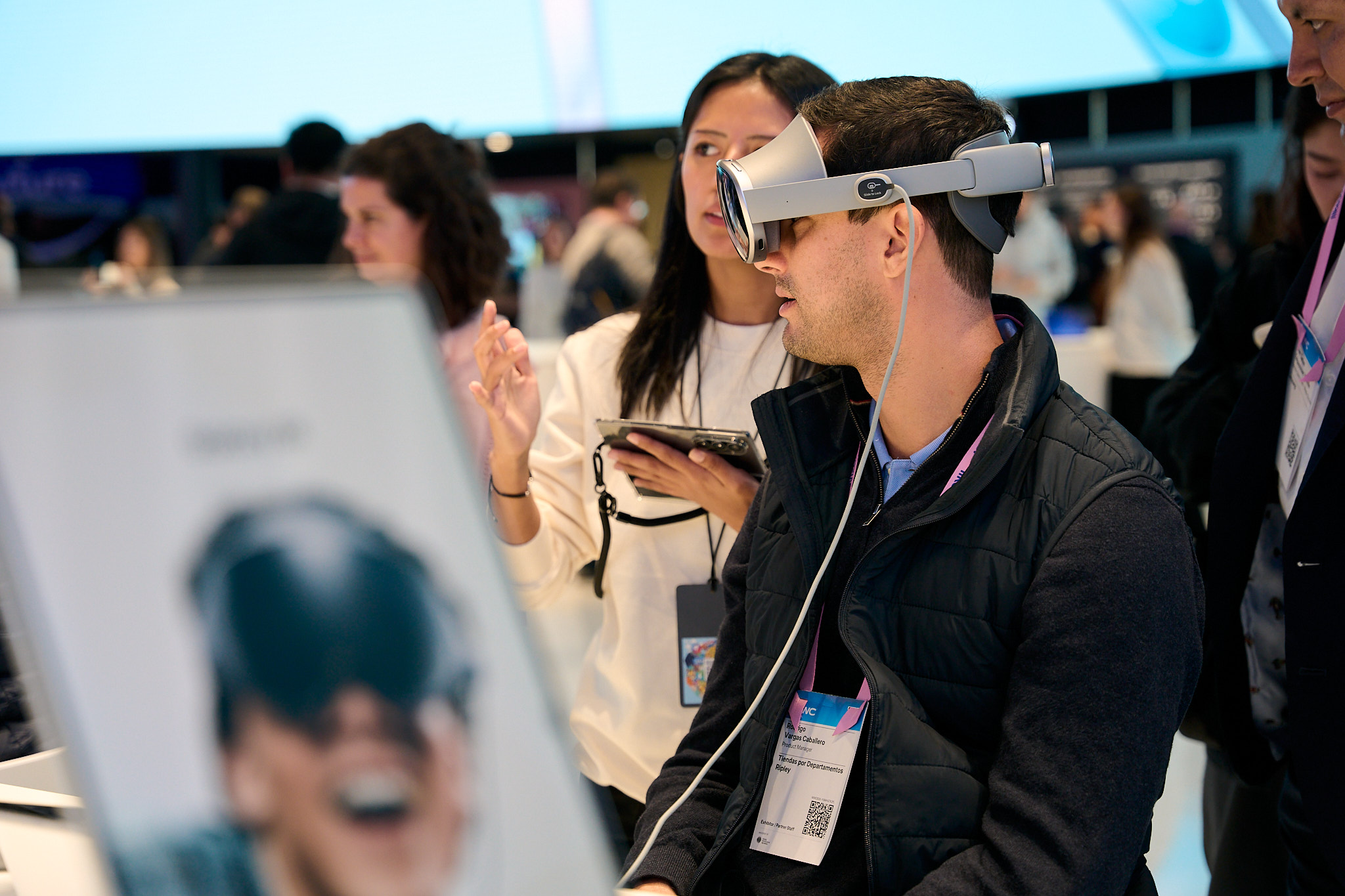 Man experiencing virtual reality headset at mwc exhibition