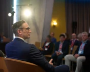 Business man participating actively in a corporate conference panel leonardo royal hotel barcelona