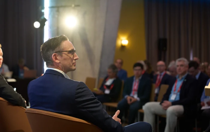Business man participating actively in a corporate conference panel leonardo royal hotel barcelona